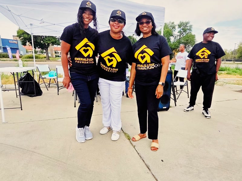 Team members at the August outreach tent