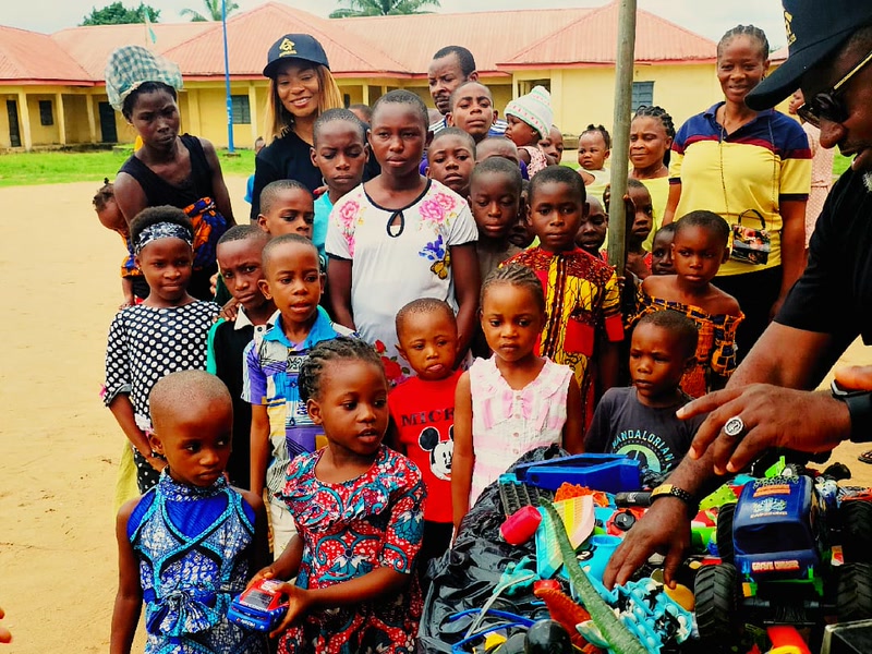 Children gathering to receive free items during the Uyo outreach giveaway