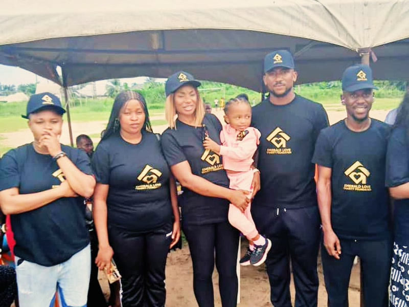ELF team members standing together under the outreach canopy in Uyo